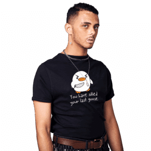 Person wearing a fun black tee featuring a cartoon goose and the text, "You have sillied your last goose.