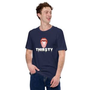 A person wears the "Thirsty" T-shirt, featuring a navy base with a bold graphic of lips and the word "THIRSTY" in dripping letters, making a daring style statement.