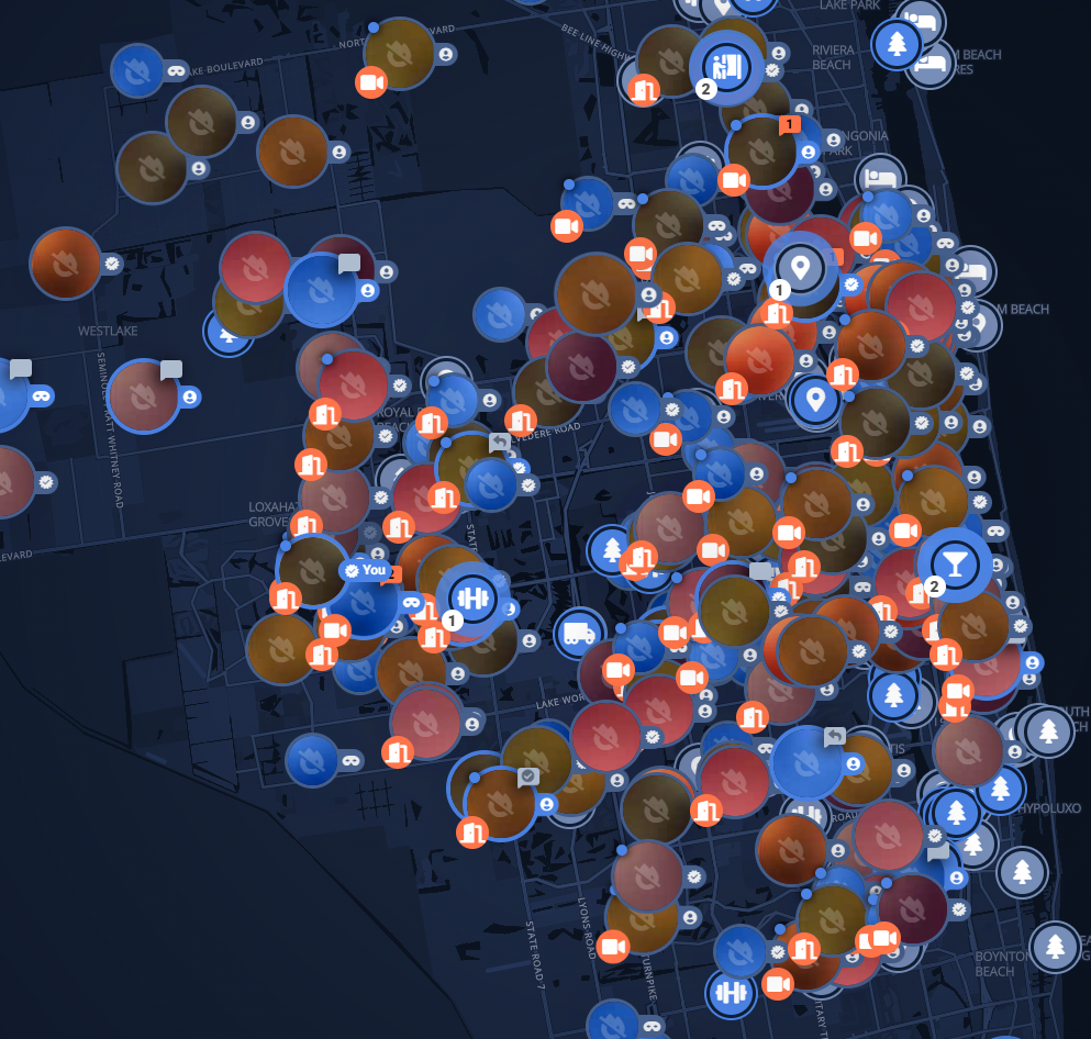 A detailed map displays numerous colored icons representing various locations and points of interest densely clustered in an urban area.