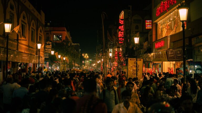 Lively city street at night glowing with colorful lights